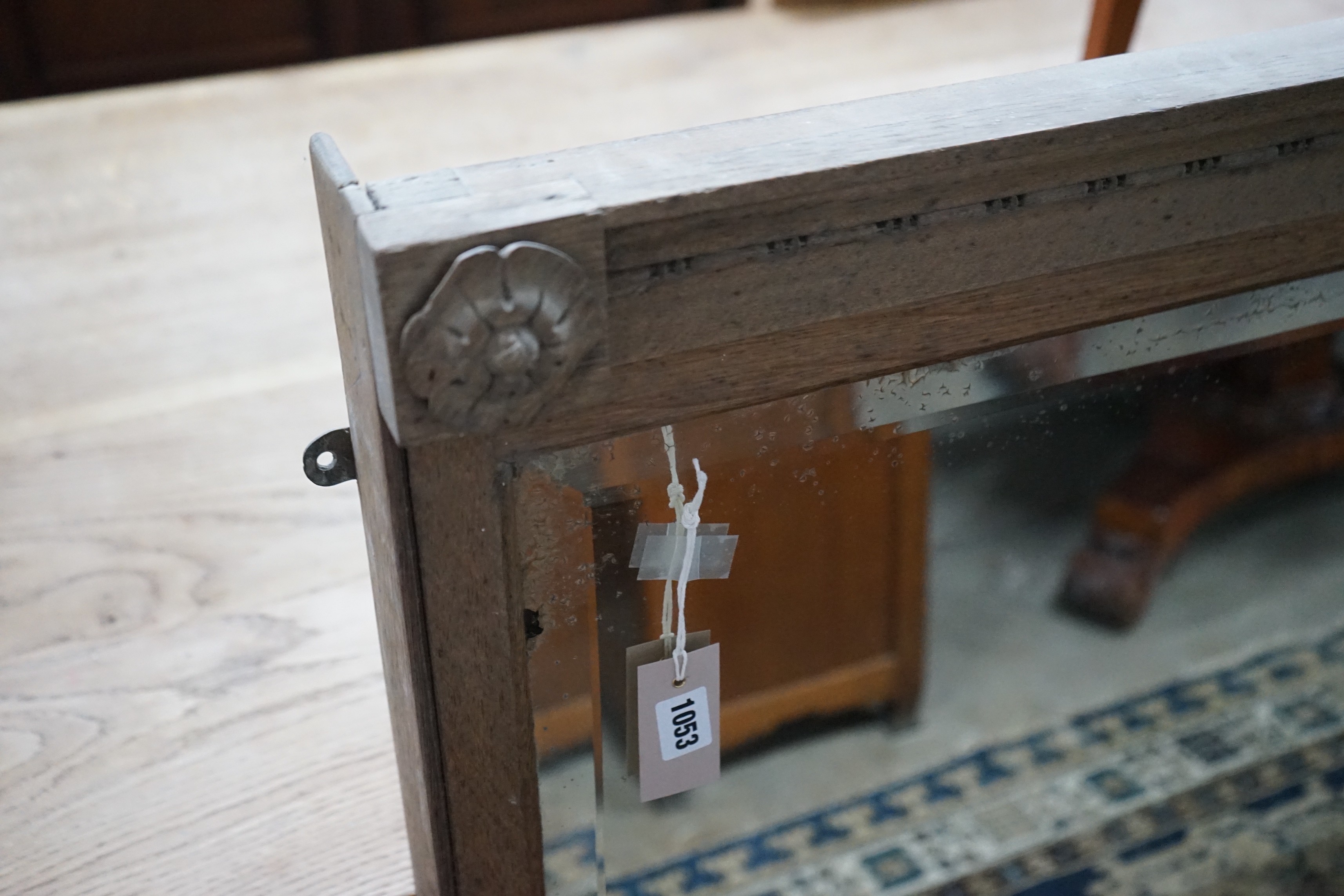 An early 20th century oak framed twin plate overmantel mirror, width 157cm, height 115cm